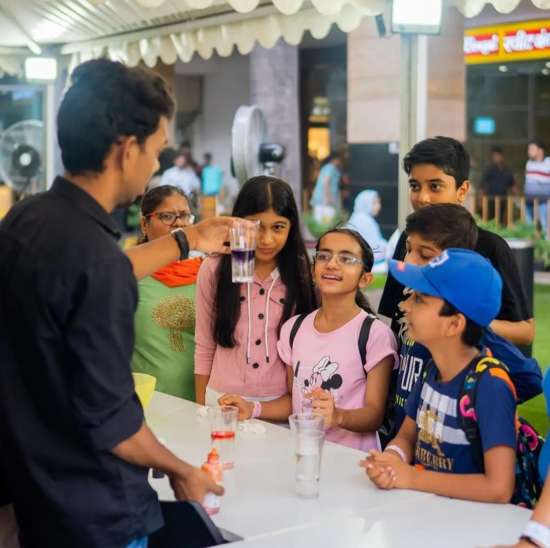 A MakerMasti host showing a colour-layer experiment to children at The Great Indian Science Festival, Airia Mall, Gurgaon
