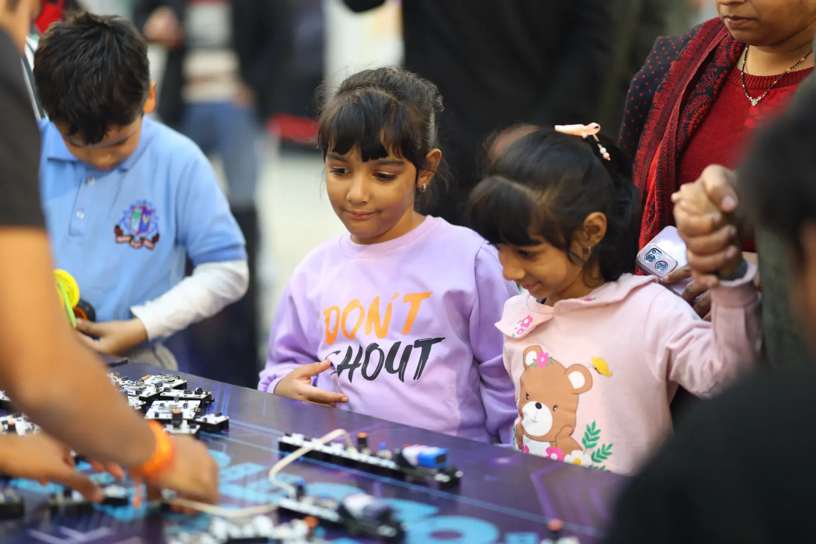 Children exploring the technology zone at a MakerMasti science festival