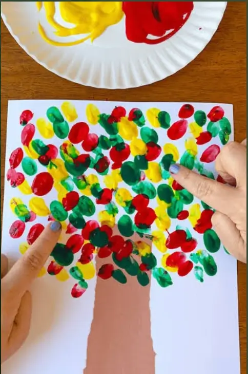 Children doing tree finger printing activity