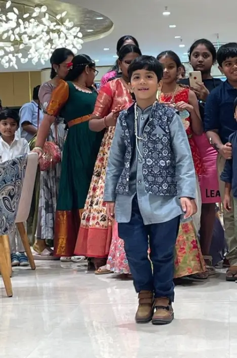 Families enjoying kids ramp walk in store